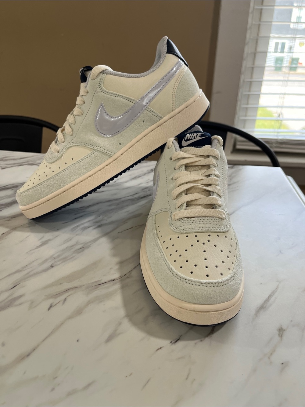 Nike woman’s Cream and Metallic Silver Low-Top Sneakers